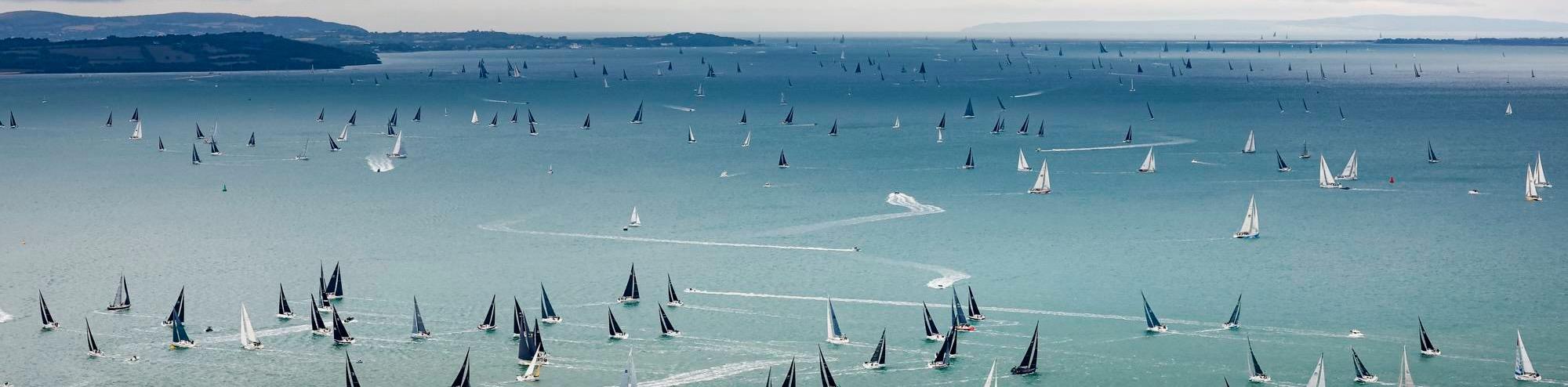 The fleet exit the Solent after the start of the Rolex Fastnet Race © ROLEX/Carlo Borlenghi