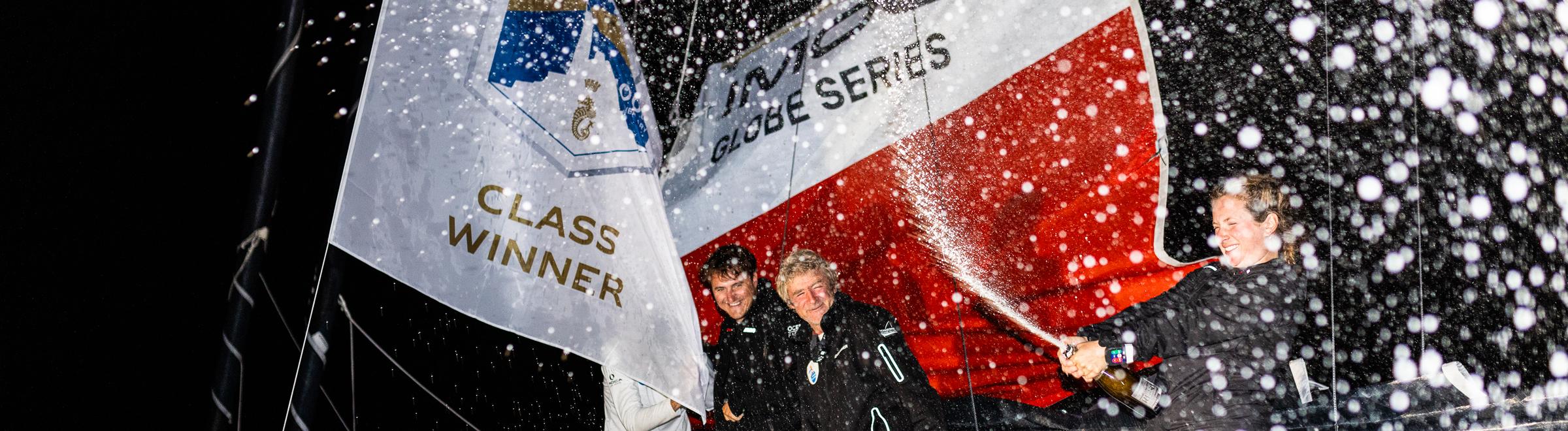 Elodie Bonafous and her team on Association Petits Princes-Queguiner celebrate finishing first IMOCA © Arthur Daniel/RORC