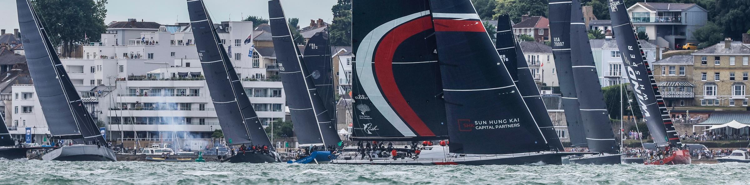 SHK Scallywag is narrowly leading the three 100-footers  as they approach the Fastnet Rock. Photo: Paul Wyeth/www.pwpictures.com