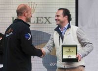 Skipper Ian Walker receives a Rolex timepiece presented by Lionel Schurch, Rolex, S.A for Abu Dhabi's monohull line honours victory. Photo: Rolex/Carlo Borlenghi