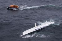 George David's capsized Rambler 100: Photo: Rolex/Carlo Borlenghi