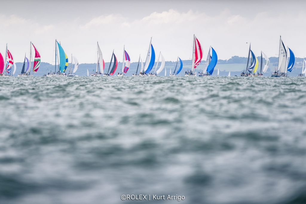 This was an unusual Rolex Fastnet start with the fleet under spinnaker out of the Solent ©  Rolex/Kurt Arrigo