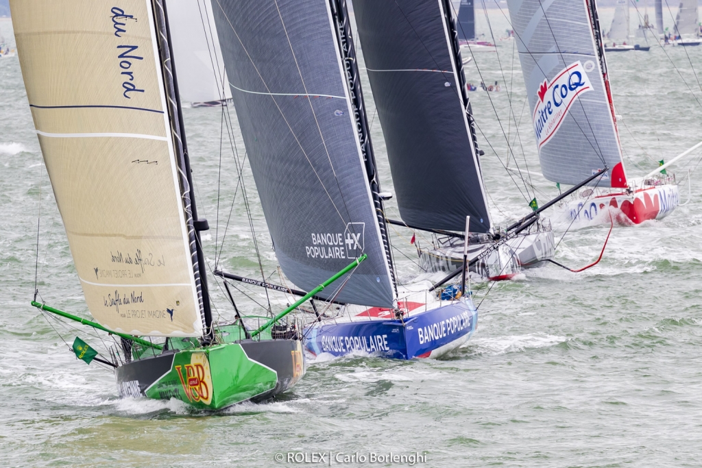 Heading off for their first night at sea, the largest fleet of IMOCA 60s to ever compete in the Rolex Fastnet Race made a spectacle at the start in the Solent © Rolex/Carlo Borlenghi
