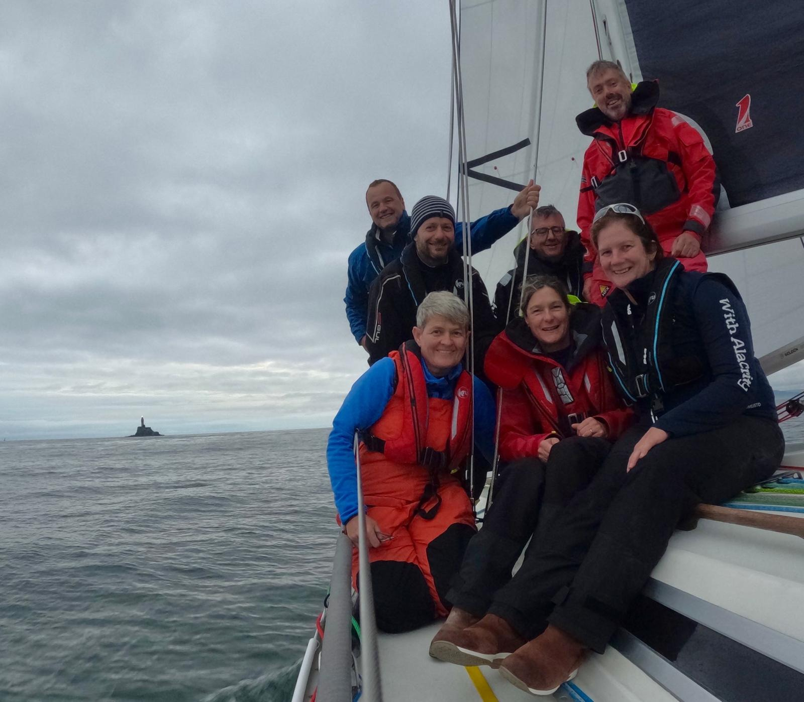 Chris and Vanessa Choules' Sigma 38 With Alacrity rounds the Fastnet Rock