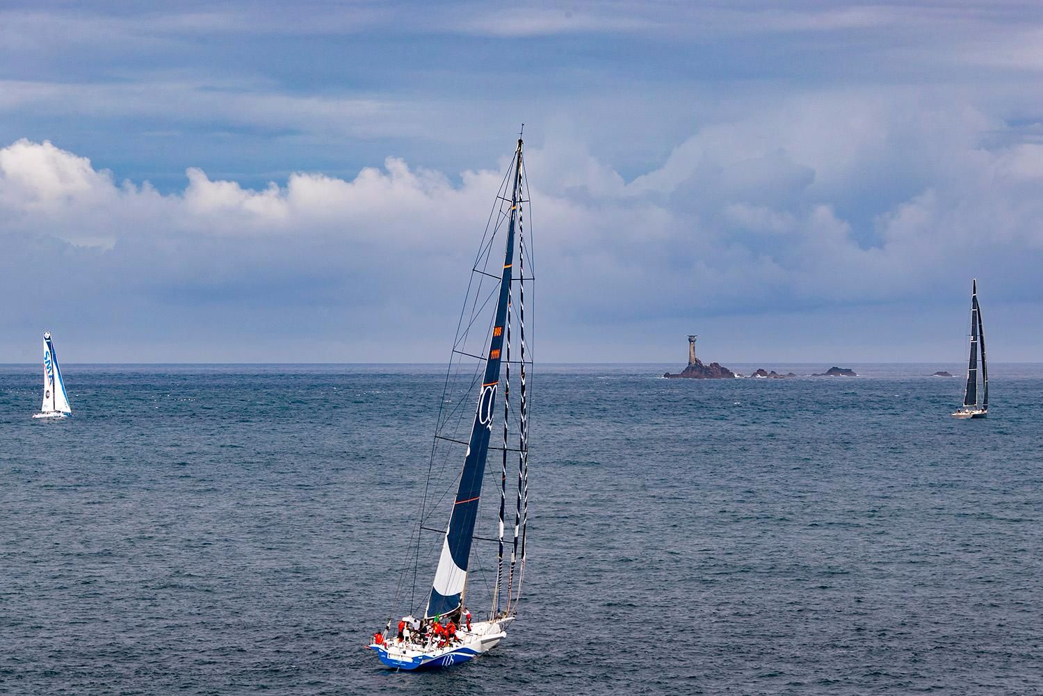 115ft Nikata and 100ft CQS proceed to the iconic Fastnet Rock. Credit: ROLEX/Carlo Borlenghi