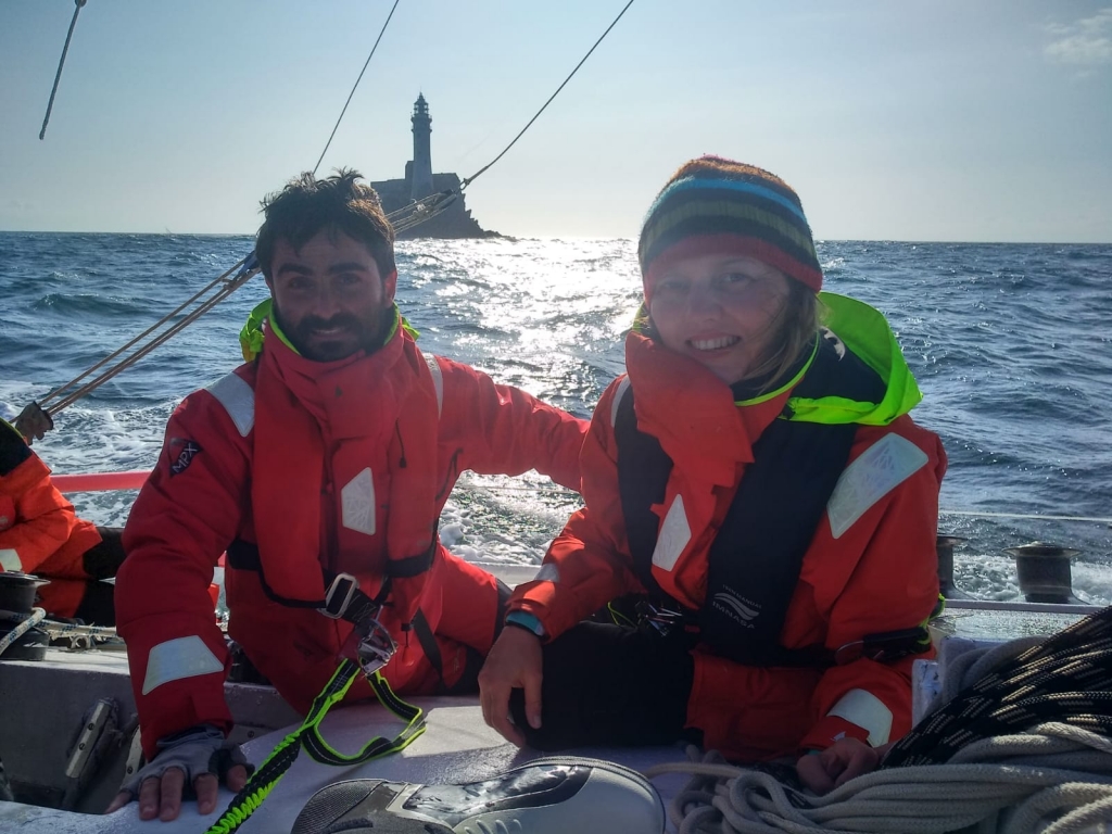 The crew of Mar Menor celebrate reaching the Fastnet Rock as the boat returned to finish the race 40 years after it started in 1979