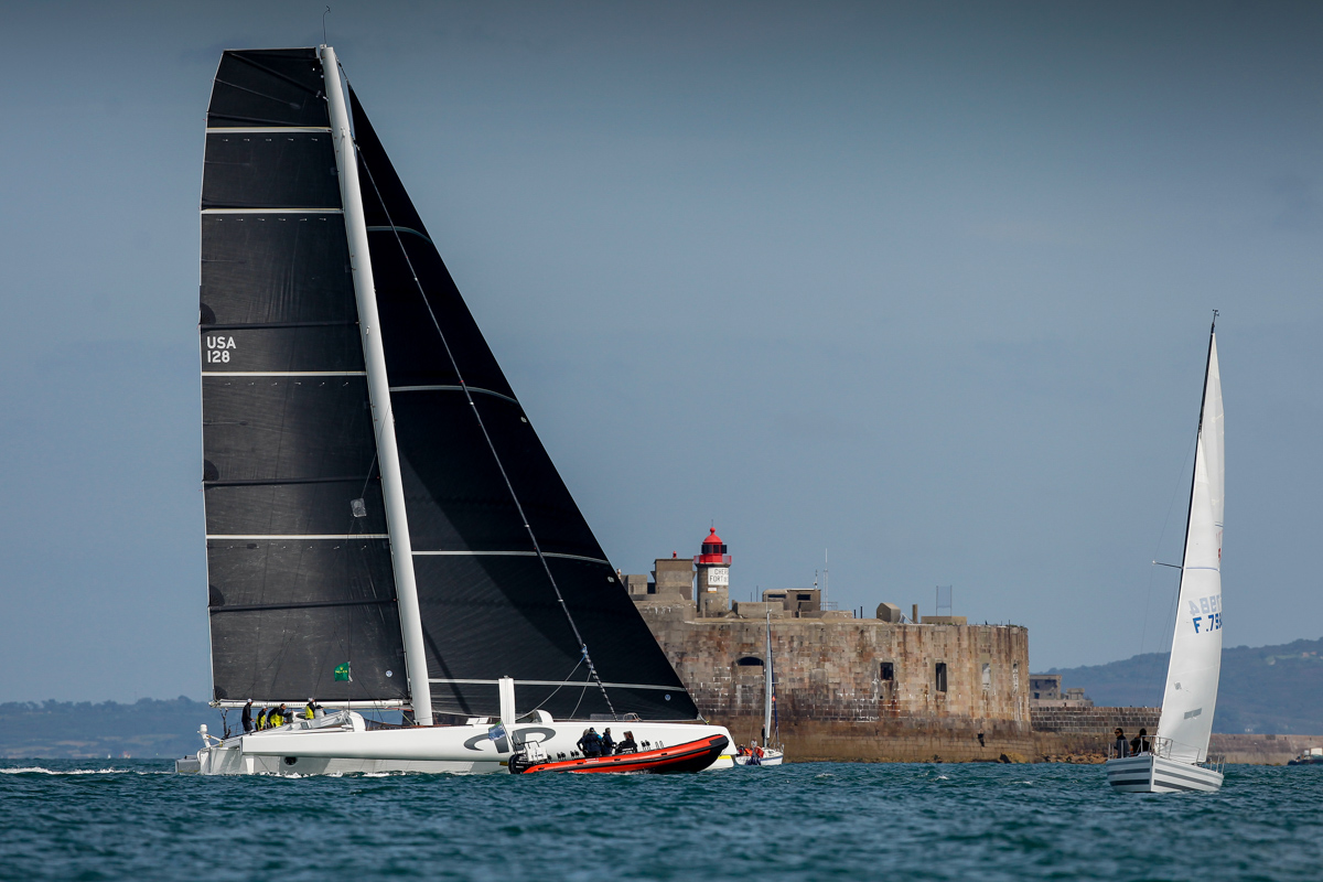 Jason Carroll's MOD70 Argo crosses the finish line off the light station on Fort De L'Ouest at 1522 BST © Paul Wyeth/pwpictures.com