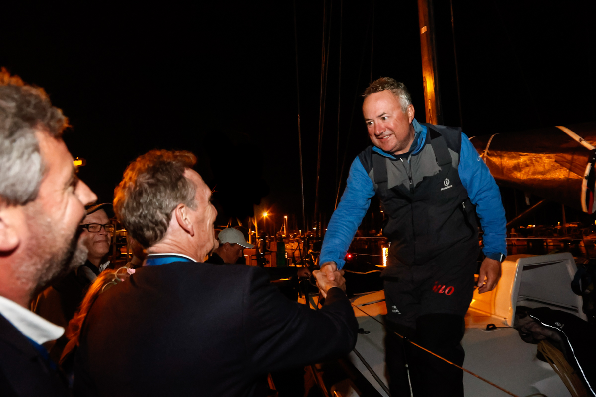 RORC CEO Jeremy Wilton and Race Director, Chris Stone congratulate RORC Commodore, James Neville and the Ino XXX crew © Paul Wyeth/pwpictures.com