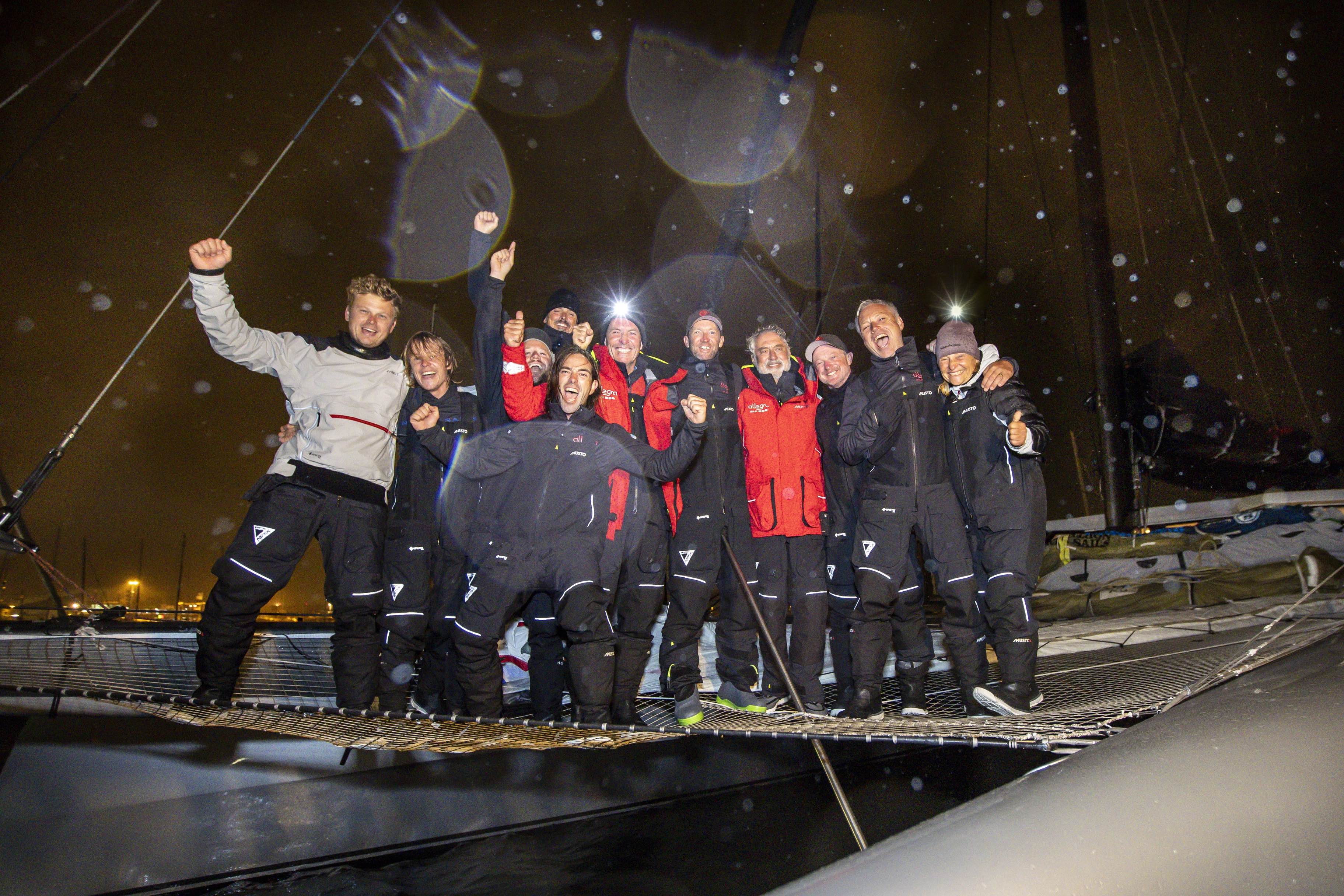 Owner Adrian Keller and crew celebrate their victory in the MOCRA multihull class © Paul Wyeth/www.pwpictures.com